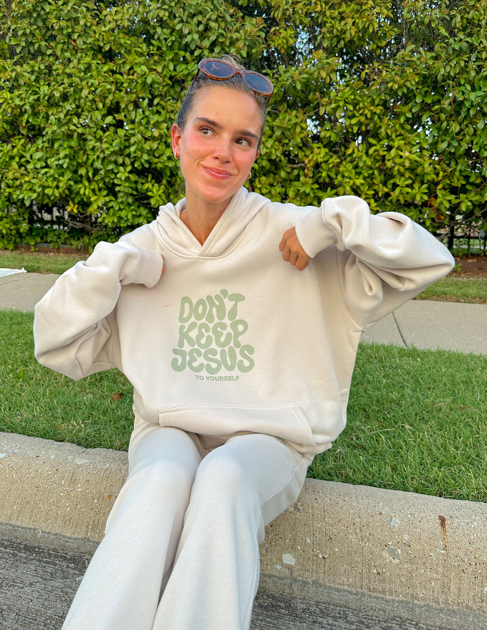 Unisex hoodie from Elevated Faith featuring the "Don't Keep Jesus to Yourself" design, in black with bold white text.