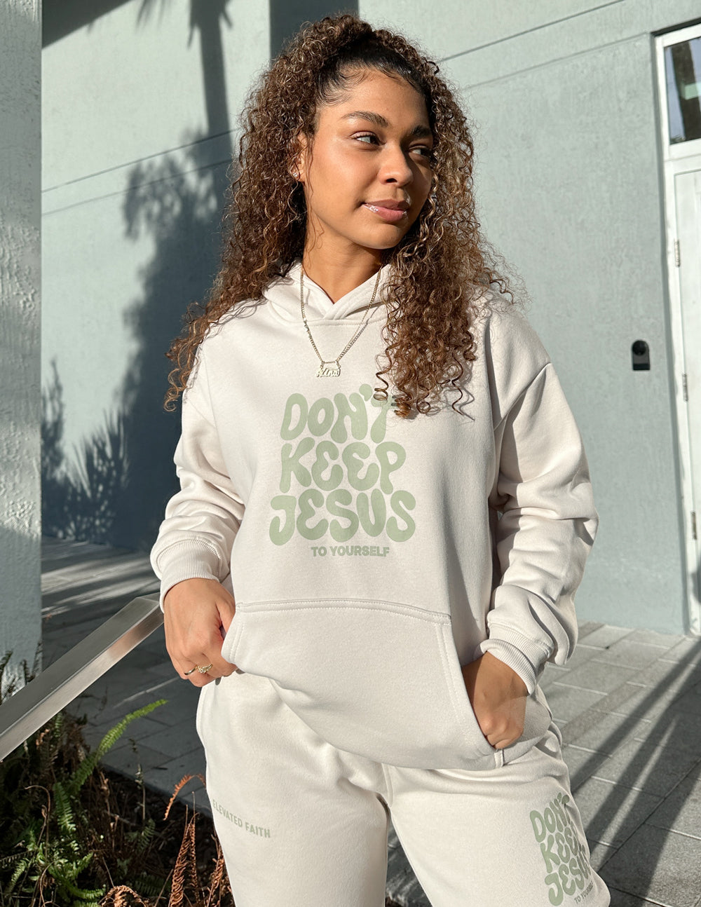 Unisex hoodie by Elevated Faith featuring the "Don't Keep Jesus to Yourself" design in black with white text.