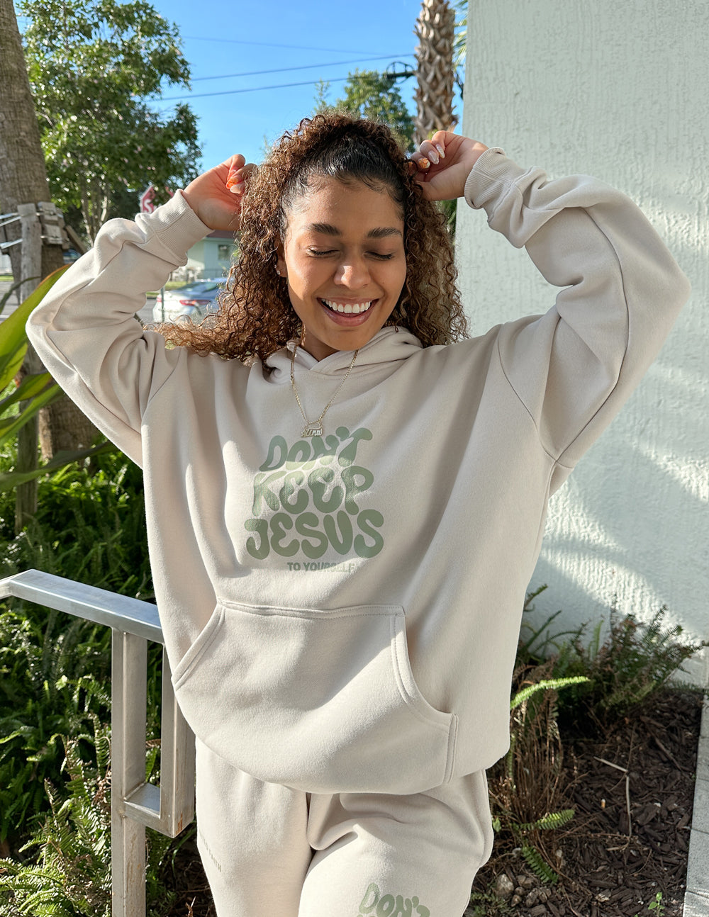 Unisex hoodie by Elevated Faith featuring the "Don't Keep Jesus to Yourself" design, in black with white print, casual fit.