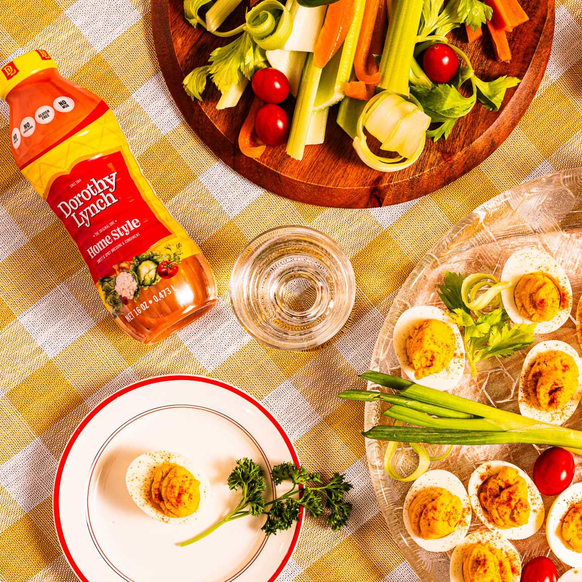 Homestyle Dorothy Lynch salad dressing bottle next to deviled eggs, showcasing gluten-free 8 oz bottle from BuyNebraska.com