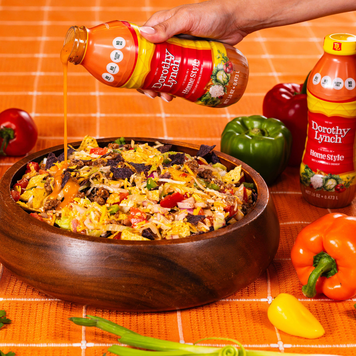 Dorothy Lynch Salad Dressing bottle with taco salad in a bowl, gluten-free, 16 oz homestyle and light & lean options, food bundle.