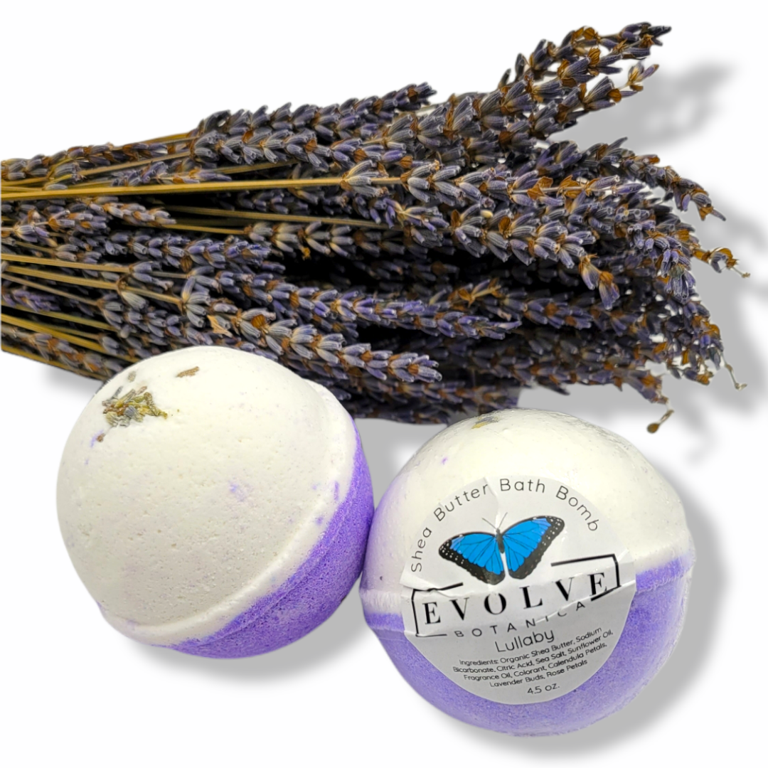 Evolve Botanica Lullaby bath bomb with soothing lavender and chamomile, shown in a clear image with the round, colorful bath bomb.