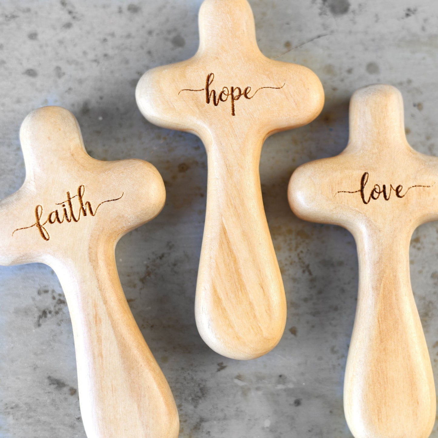 Wooden engraved prayer cross from the Holy Land by Dennehey Design Co., featuring intricate carvings and a polished finish.