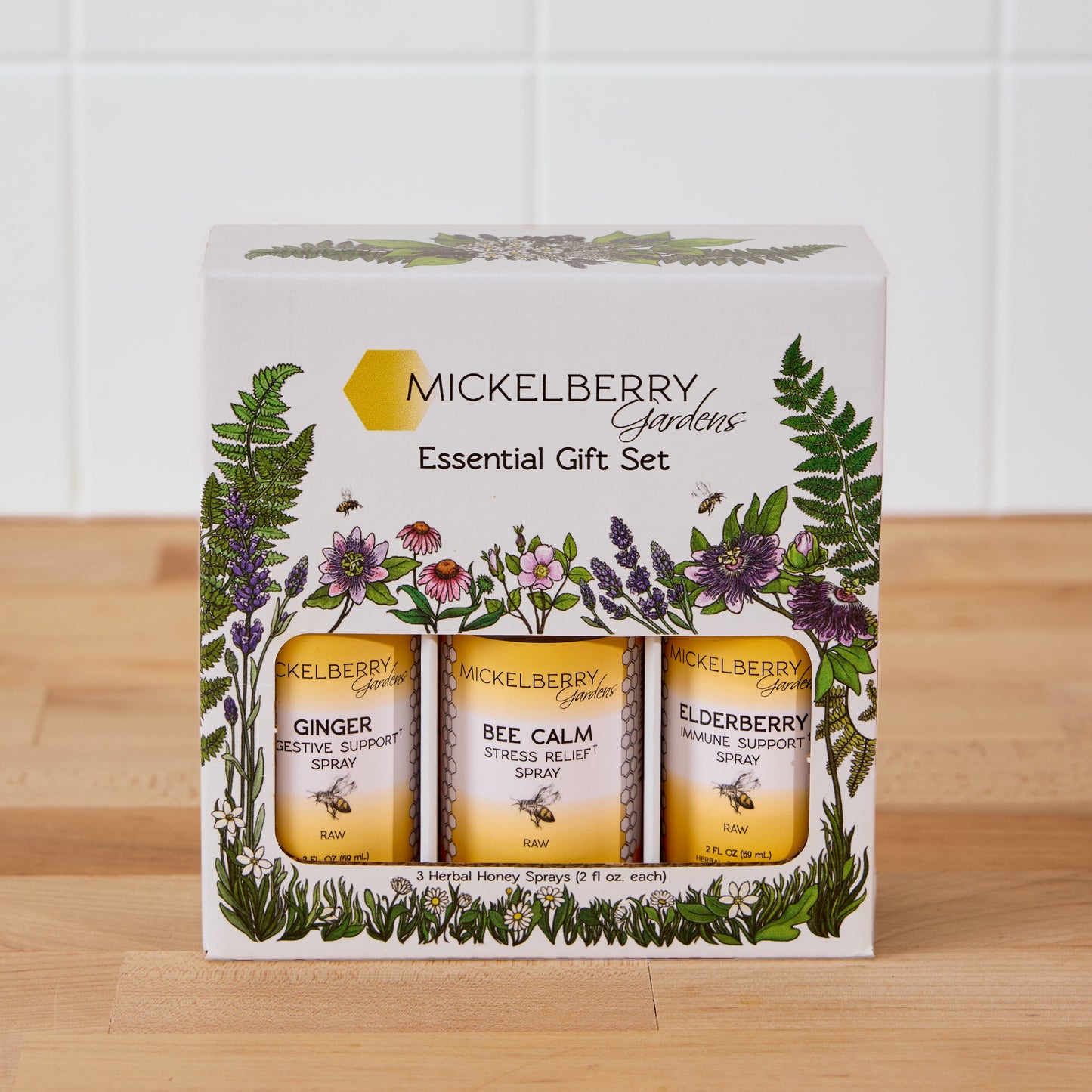 Mickelberry Gardens Honey Tonic Essential Gift Set with bottles of honey and herbal tonic in a decorative box.