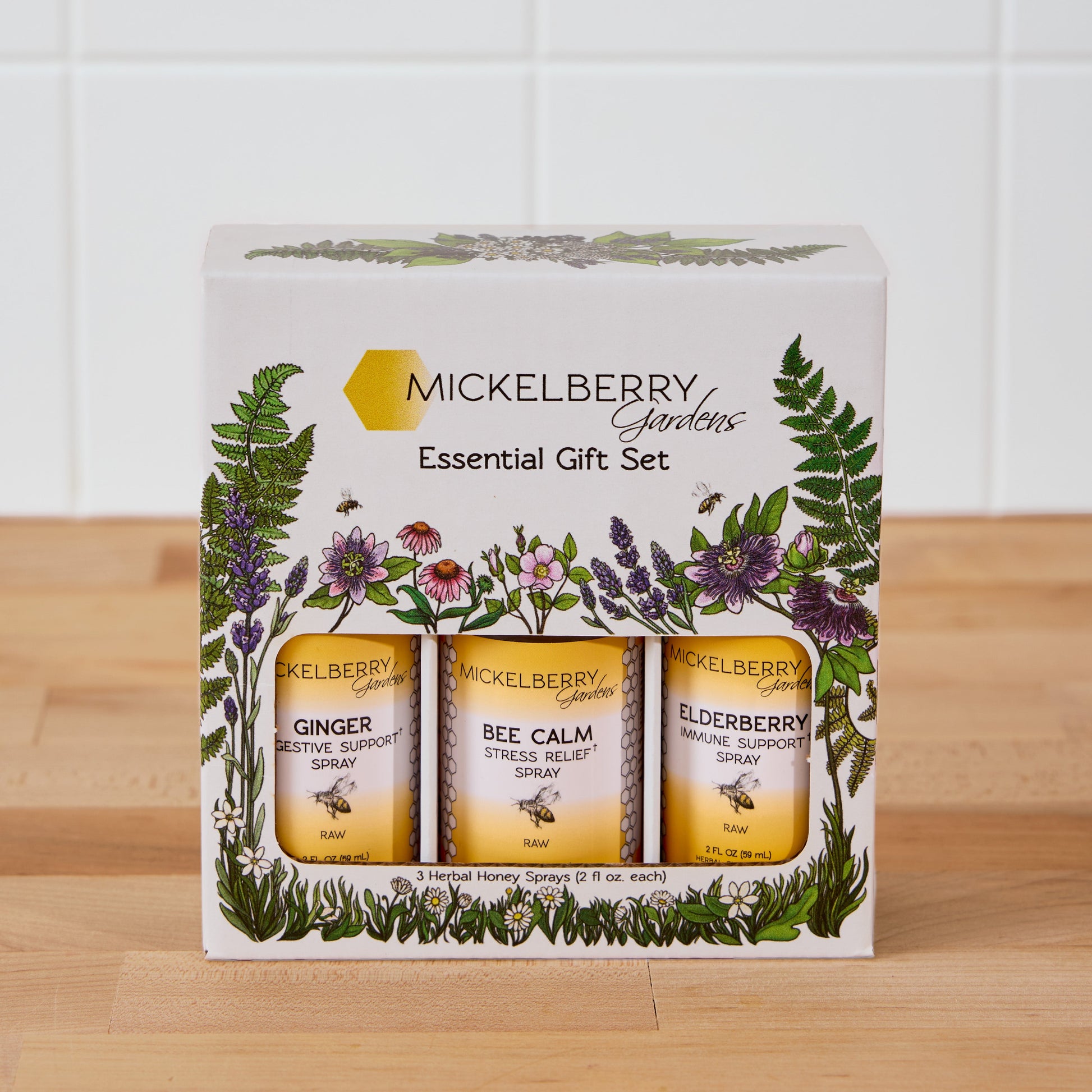 Mickelberry Gardens Honey Tonic Essential Gift Set with bottles of honey and herbal tonic in a decorative box.