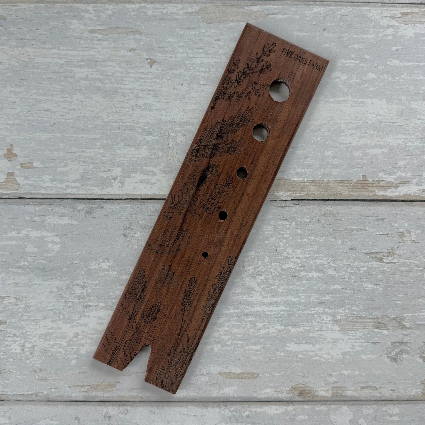 Five Oaks Farm herb stripper tool with multiple stainless steel stripping holes for quickly removing herbs from stems.