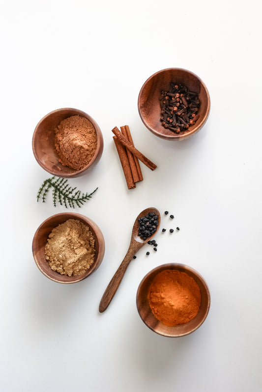 DIY pint-sized elderberry syrup kit by Blessed by Elderberries, featuring jars, bottles, and ingredients for homemade elderberry syrup.