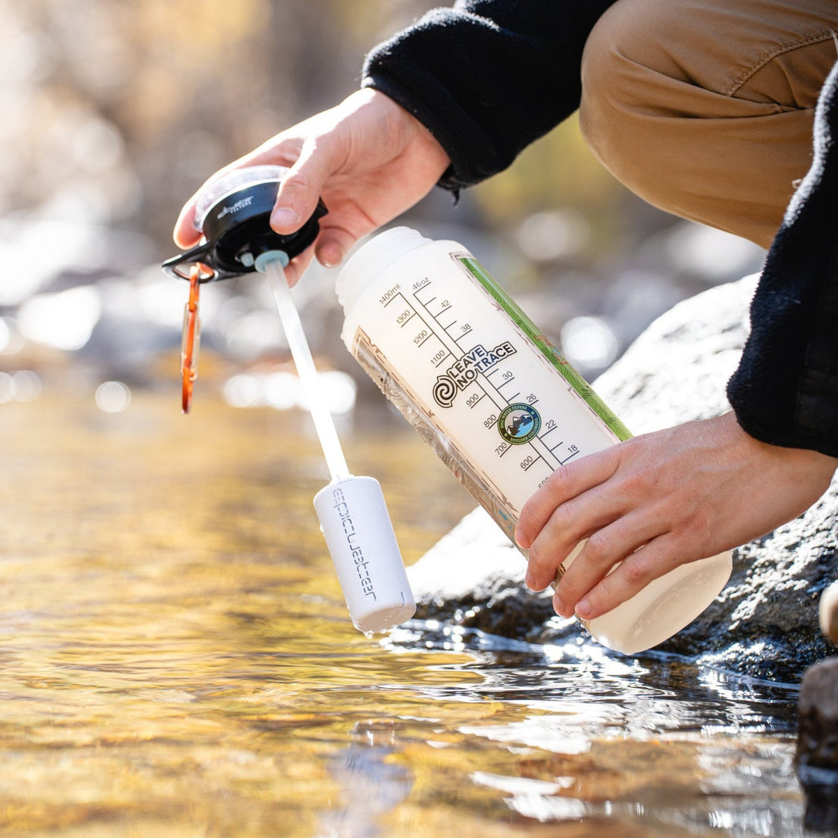 Epic Water Filters Everywhere Bottle Filter with casing, showing the compact water filter and transparent casing for clean drinking water.