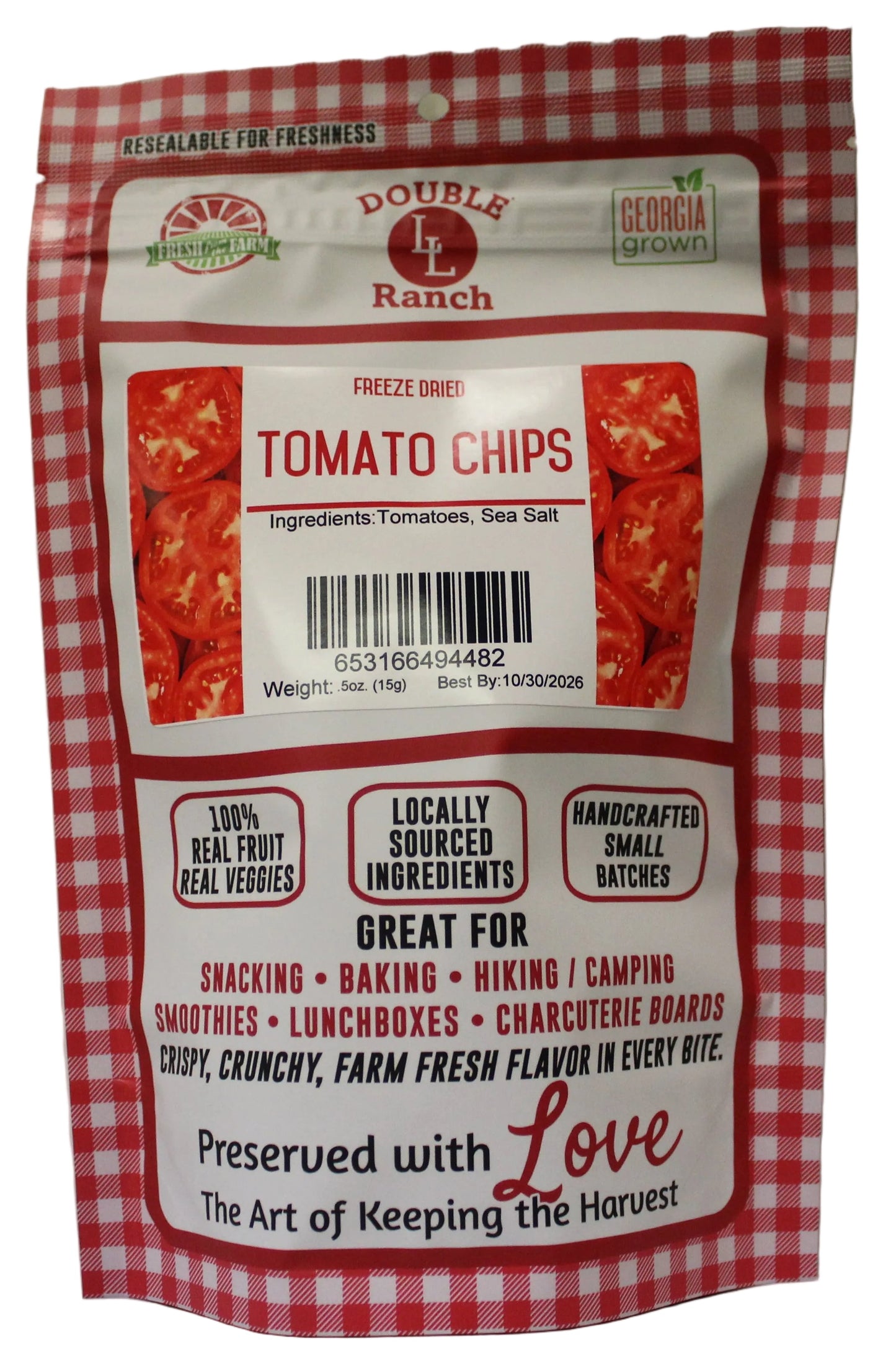 Freeze dried tomato chips by Double L Ranch, showing crispy, vibrant red tomato slices in a clear bowl.