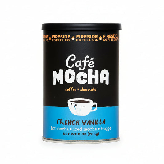 Creamy French Vanilla Cafe Mocha from Fireside Coffee Co. served in a mug with whipped cream and chocolate drizzle.