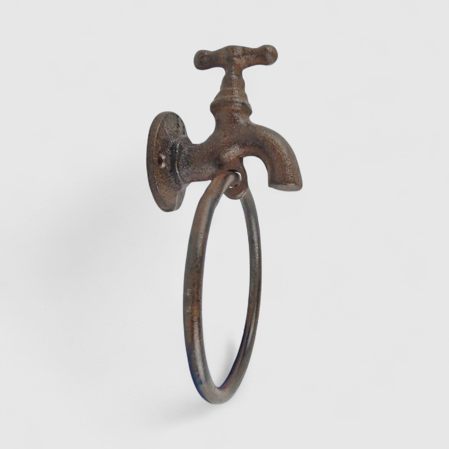 Iron & Blossom Quirky cast iron faucet towel holder with industrial farmhouse style, mounted on bathroom wall for towel storage.
