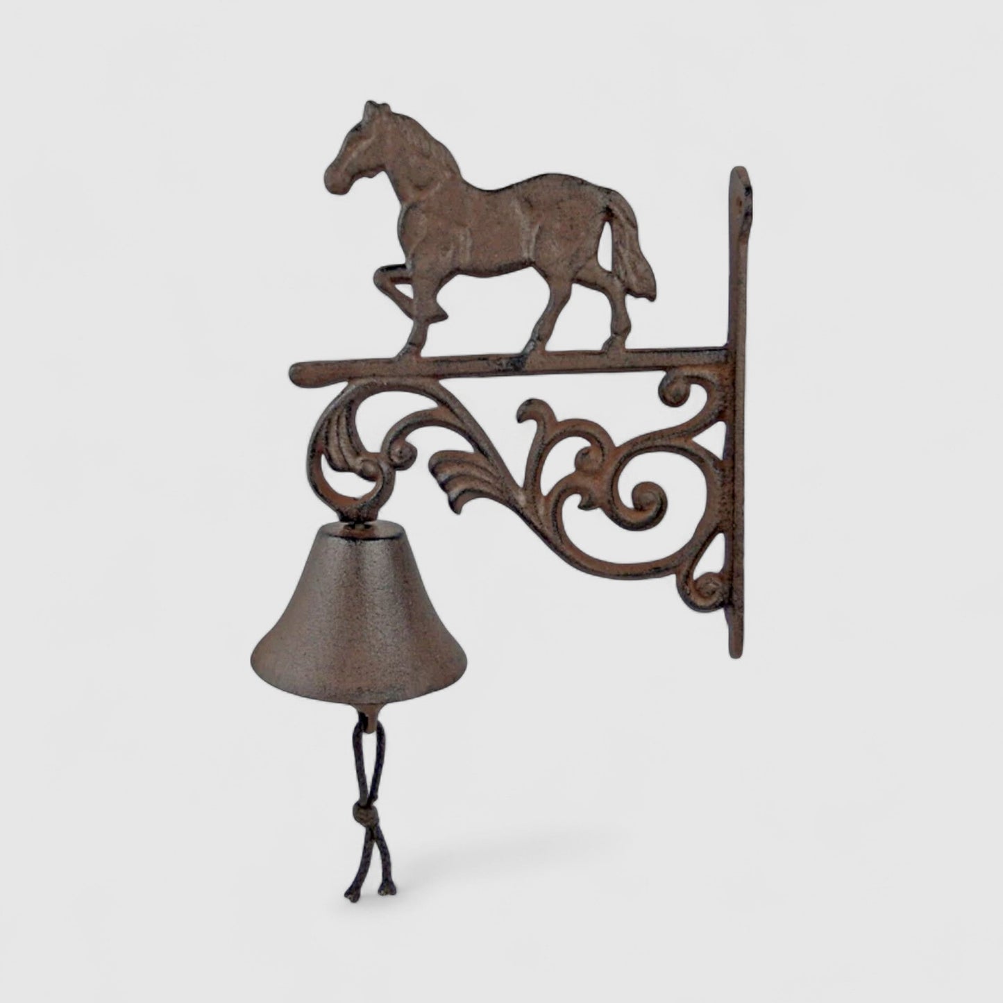 Rustic Iron & Blossom horse-shaped cast iron bell with farmhouse design, suitable for door chime or decorative use.