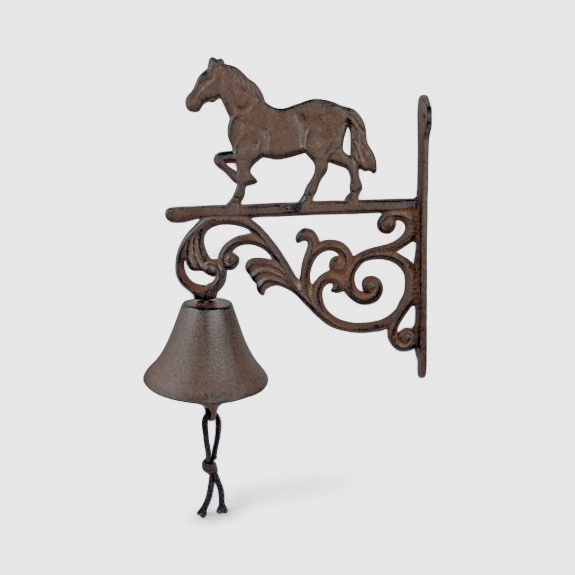 Rustic Iron & Blossom horse-shaped cast iron bell with farmhouse design, suitable for door chime or decorative use.