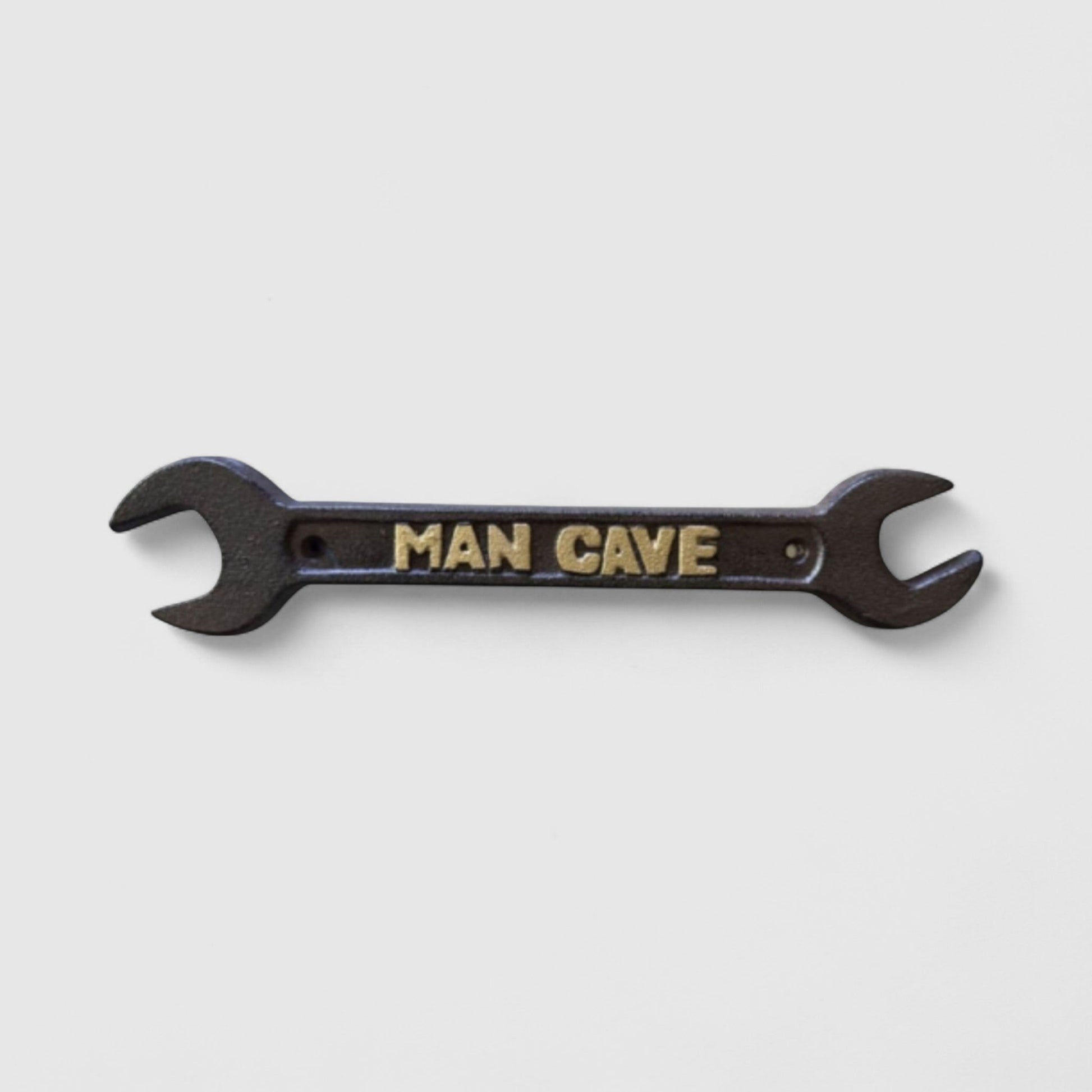 Iron & Blossom cast iron spanner wrench man cave plaque featuring rugged industrial decor with a vintage wrench design.