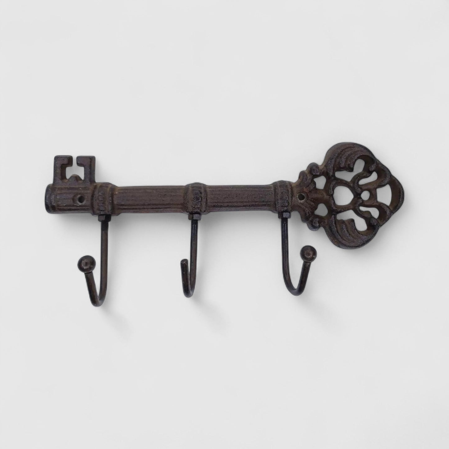 Vintage Iron & Blossom cast iron key hook rack with antique-style design, wall-mounted organizer for keys and small items.