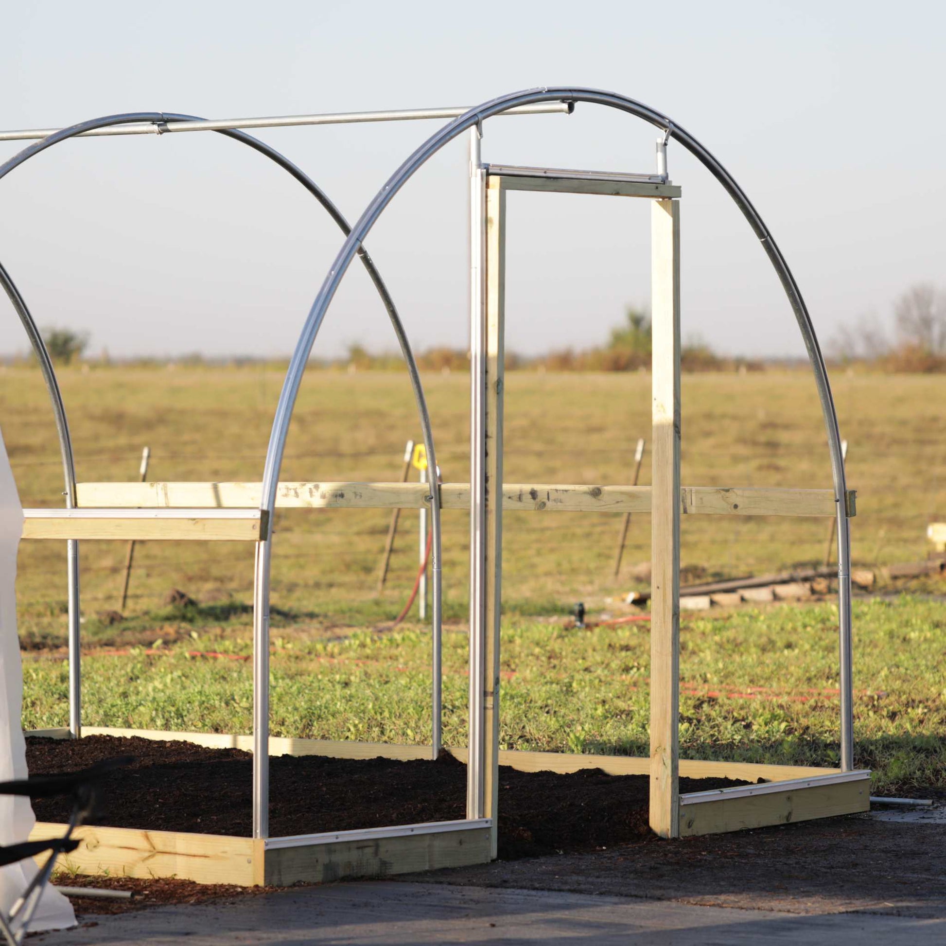 Bootstrap Farmer hobby greenhouse end wall door frame kit with framing and hardware for easy installation.