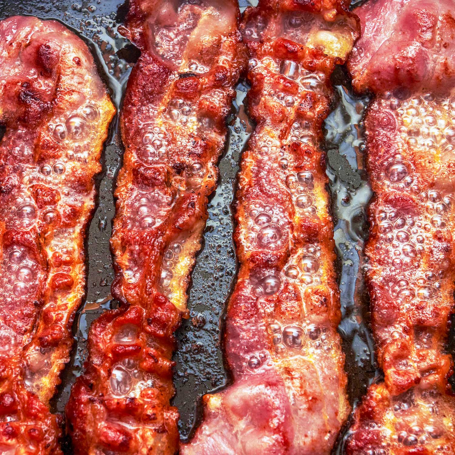 Assorted bacon gifts for bacon lovers featuring smoky, crispy bacon treats from Pig of the Month BBQ, perfect for gift-giving.