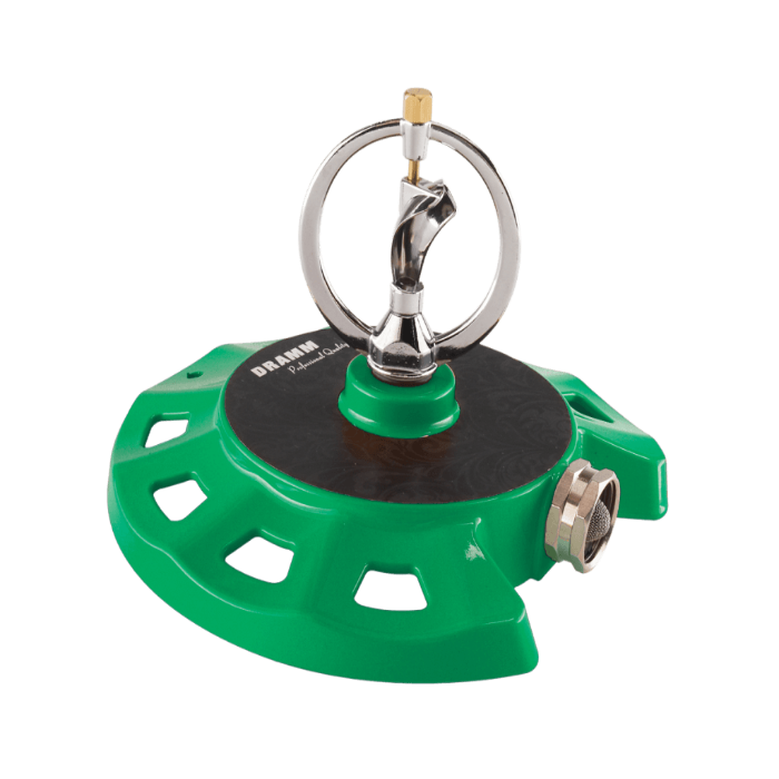 Green Dramm ColorStorm Spinning Sprinkler used for lawn watering, featuring adjustable spray pattern and durable plastic construction.