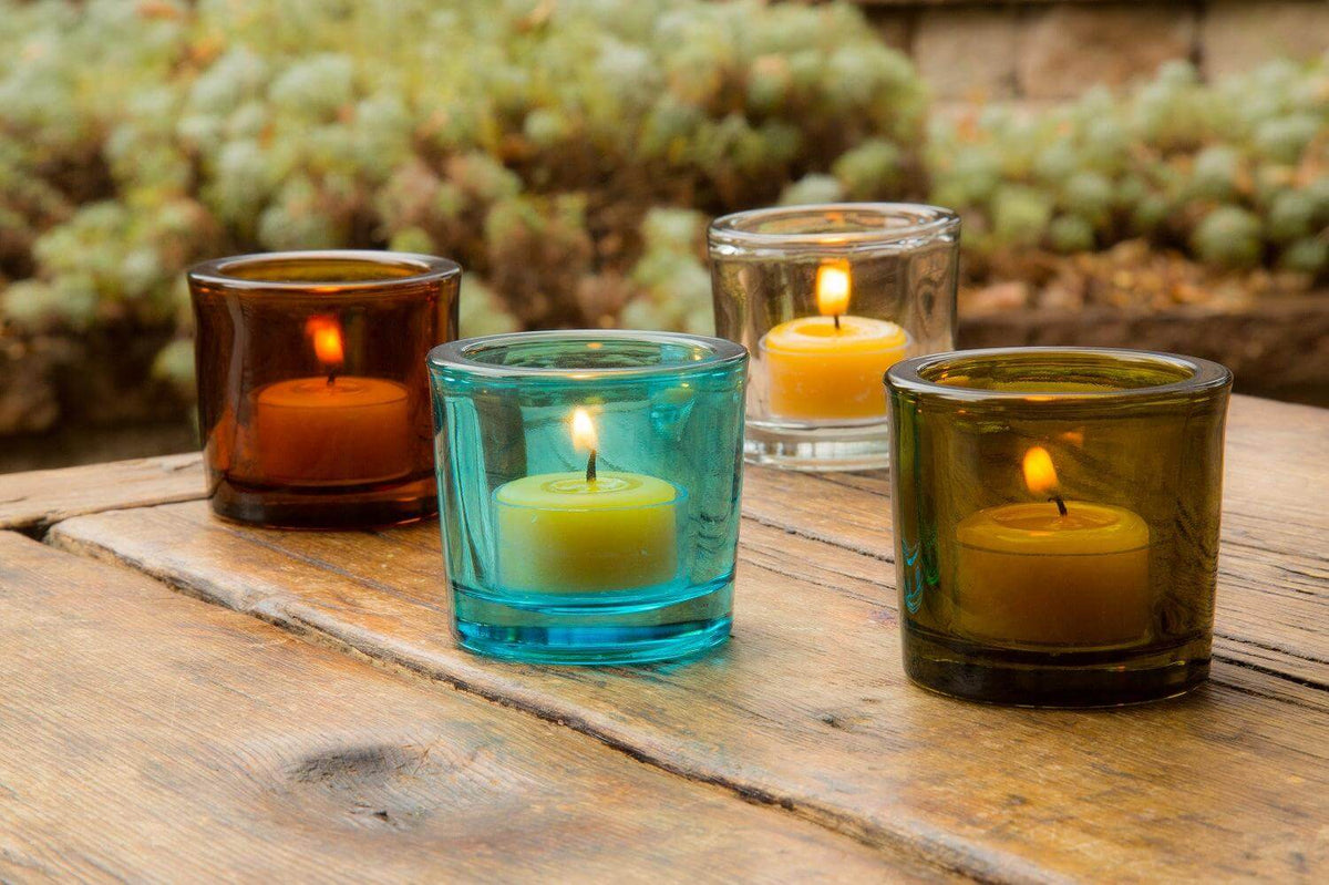 Bluecorn Candles heavy glass votive candle holder made from recycled glass, with a clear, smooth finish and a cylindrical shape.