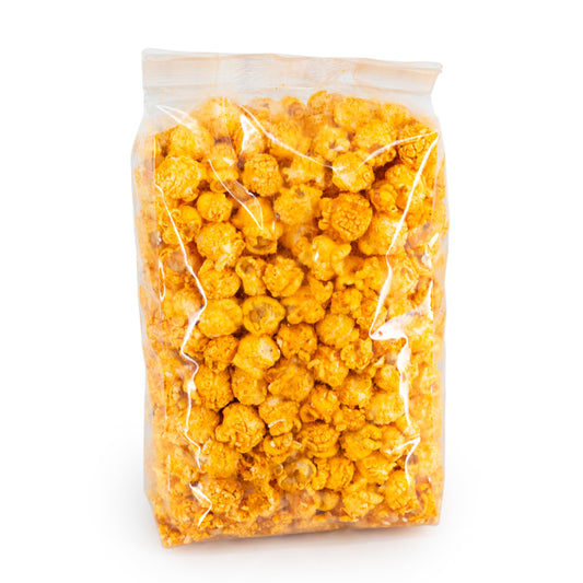 Cheddar Inferno popcorn by HR Poppin' Snacks, 3.5 oz bag showing spicy cheddar cheese coated popcorn.