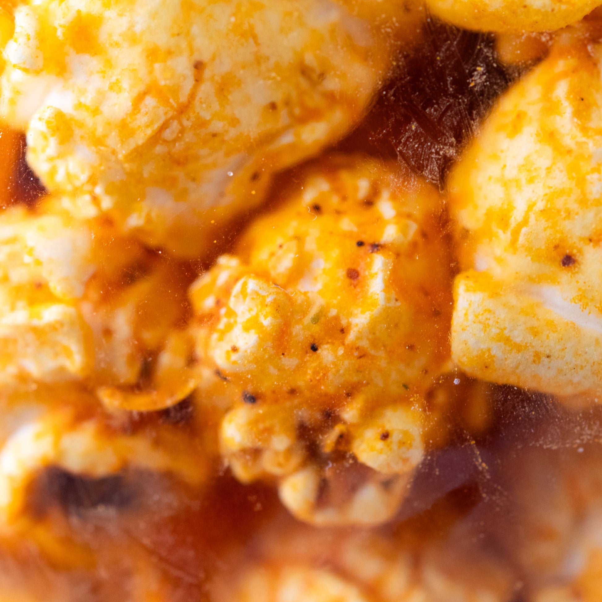 Spicy cheddar inferno popcorn by HR Poppin' Snacks in a 3.5 oz bag, featuring bold cheese and fiery flavor.