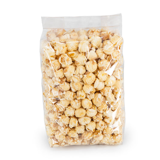 Frosted cinnamon roll popcorn in an 8 oz package from HR Poppin' Snacks, featuring sweet cinnamon glaze and crunchy popcorn.