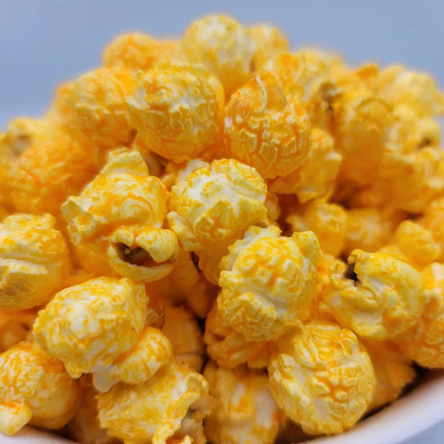 Cheese popcorn in a 3.5 oz bag from HR Poppin' Snacks, featuring cheesy, crunchy popcorn with vibrant packaging.
