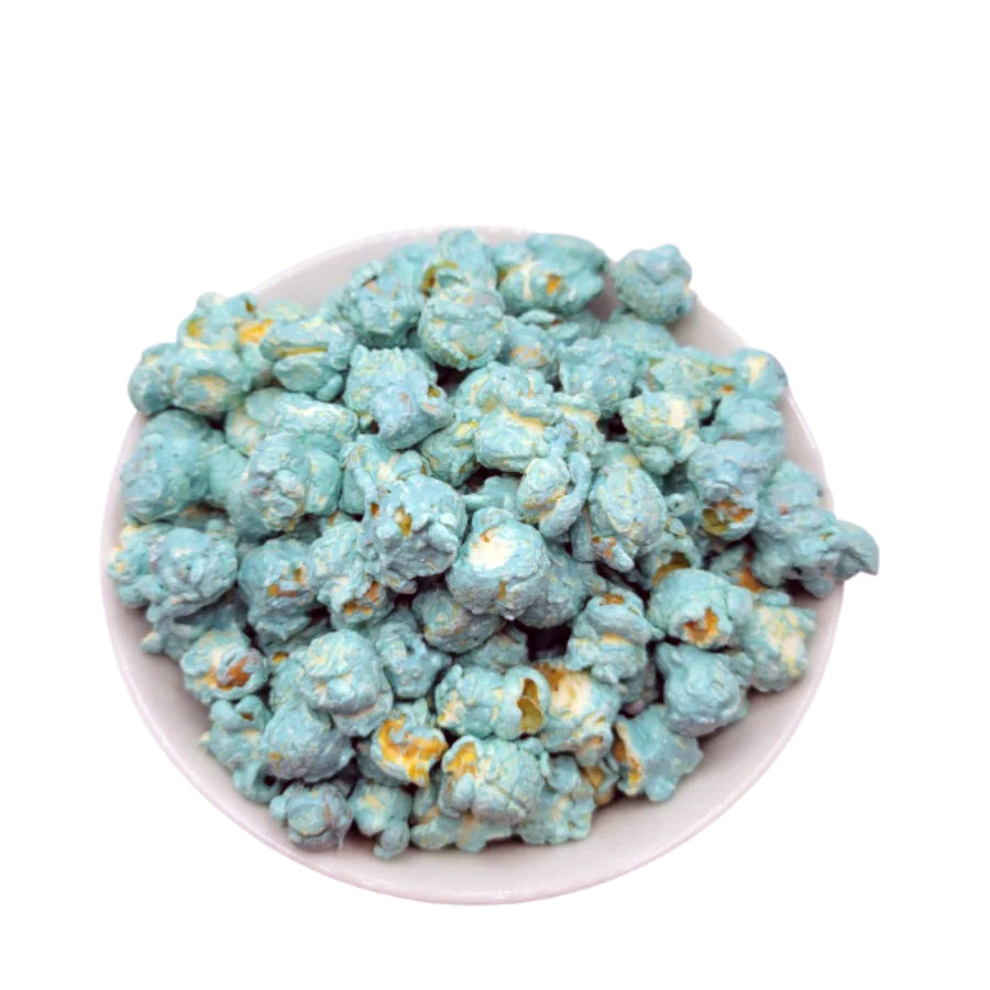 Blue marshmallow flavored popcorn from HR Poppin' Snacks, featuring It's A Boy theme, shown in a colorful serving bag.