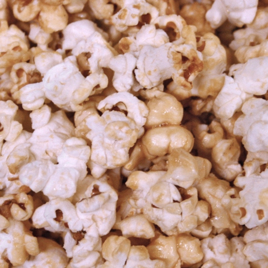 5 oz Kettle Popcorn from HR Poppin' Snacks, showcasing a bowl of freshly popped, golden kettle popcorn in a natural setting.