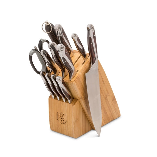 Set of Hammer Stahl Heritage Steel 12-piece cutlery including knives, forks, and spoons arranged on a wooden table.