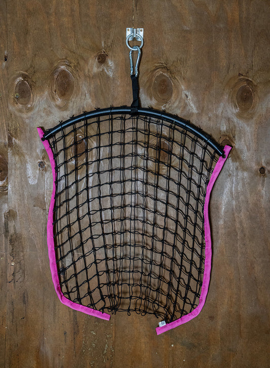 Limited edition hot pink haynet from Haylo Haynets, LLC, featuring a durable, tightly woven design for horse feed storage.