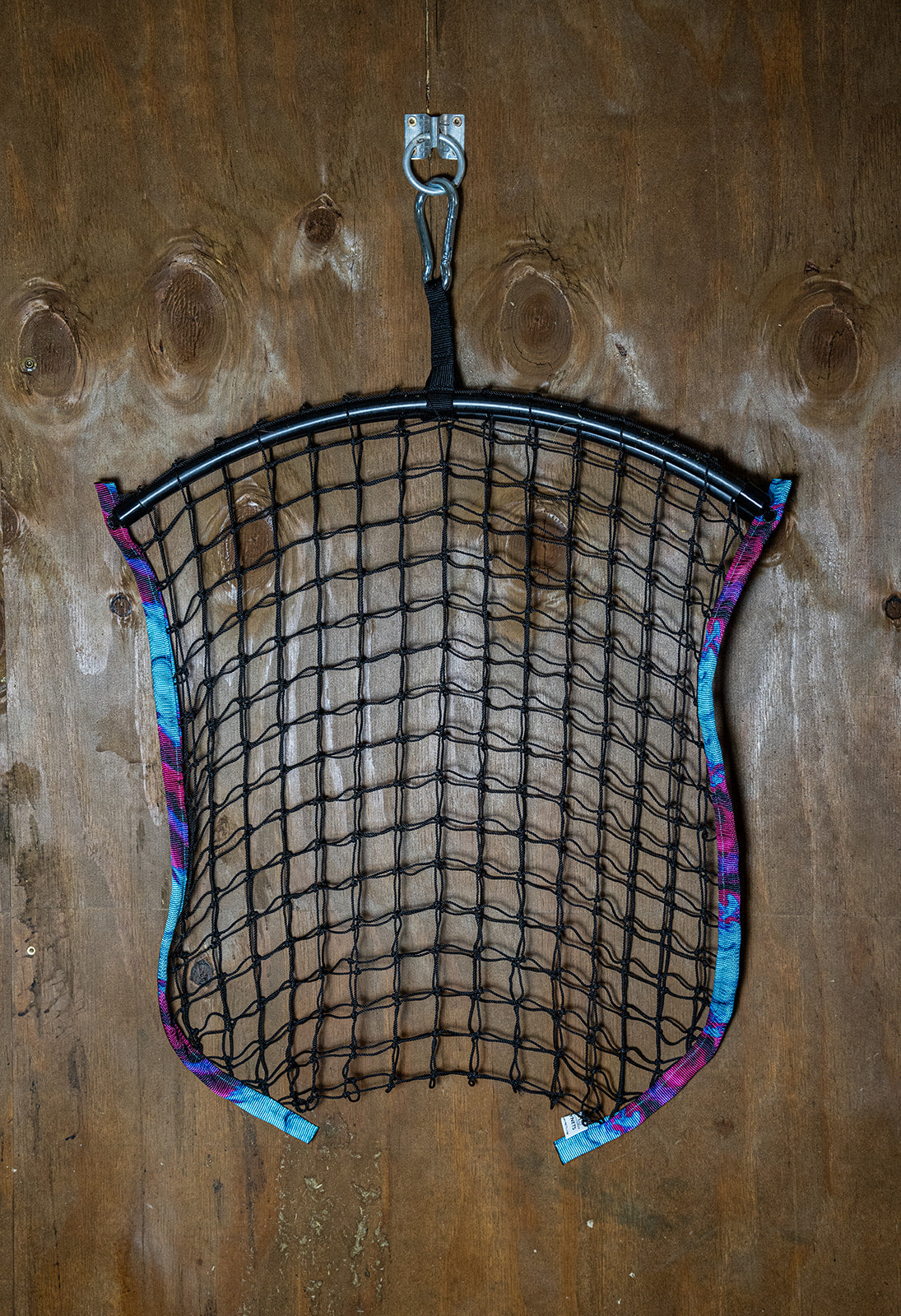 Limited edition Haylo Haynets LLC haynet in black with a woven design, suitable for horse feeding and hay storage.