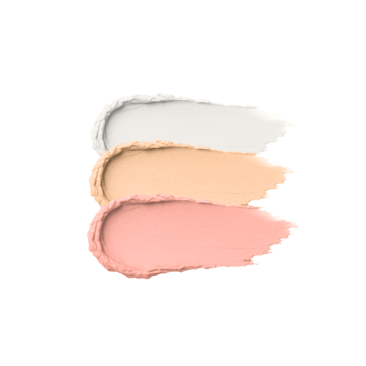Cream highlighter multistick by Taylor Made Organics with a swatch showing its luminous, blendable glow on skin.