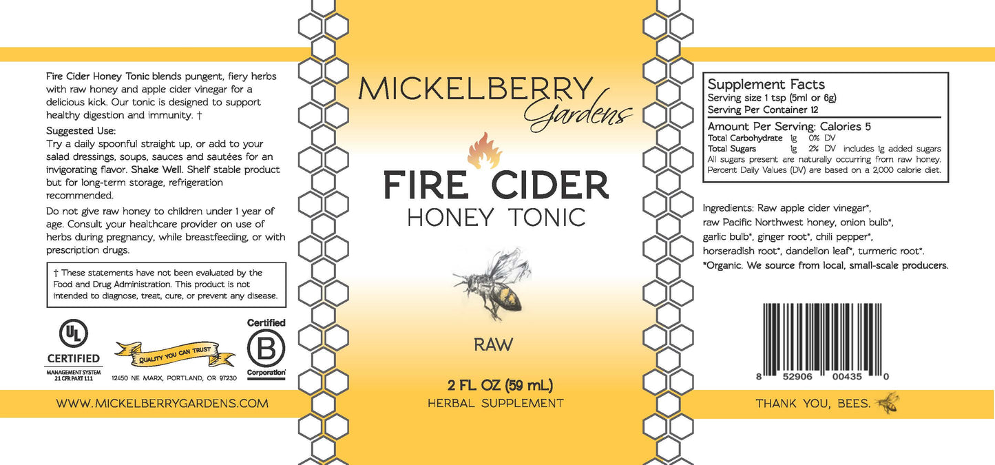 Mickelberry Gardens Fire Cider Honey Tonic in a 2oz bottle, showing the label and amber-colored honey tonic liquid.