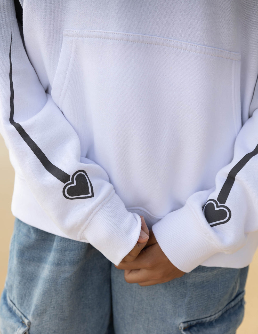 Unisex hoodie by Elevated Faith featuring "I Love Jesus" text on front, casual fit, soft fabric in a relaxed style.