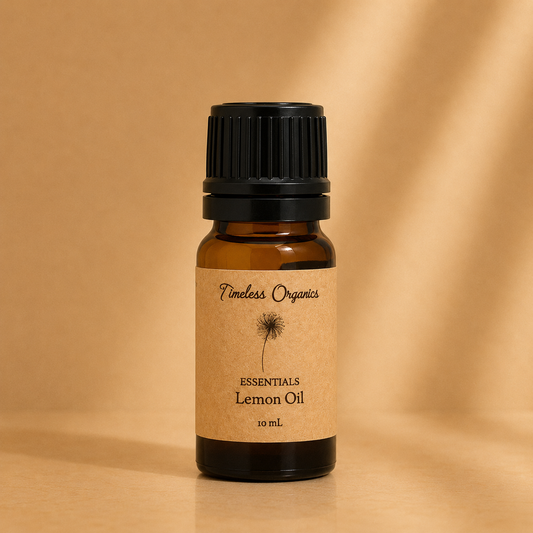 Amber glass bottle of Timeless Organics Skin Care Essentials Lemon Oil with black screw cap, 10 mL, on a beige background.