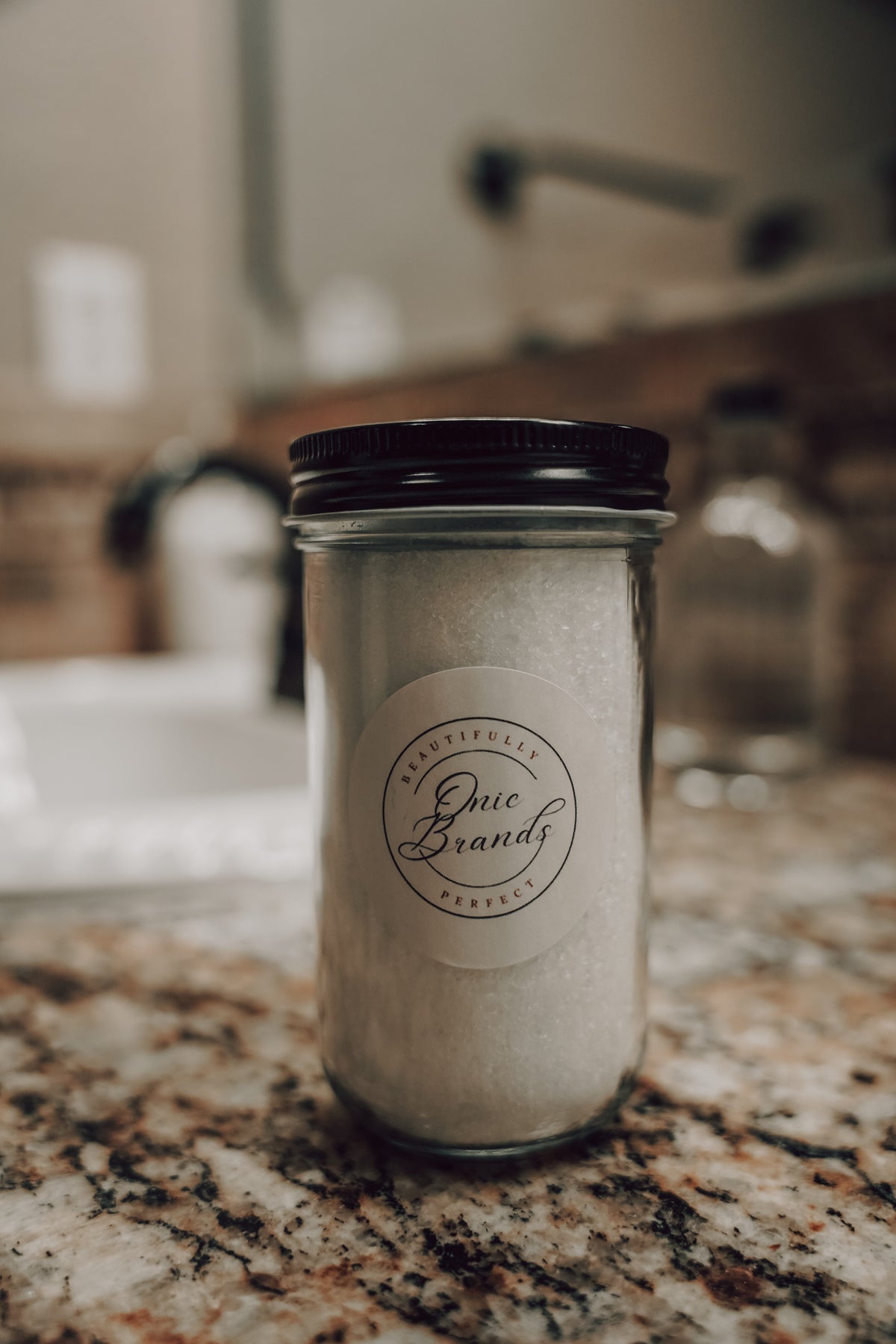 Magnesium bath and foot soak additive from Onic Brands LLC, showing a jar of relaxing bath salts with magnesium for soothing baths.