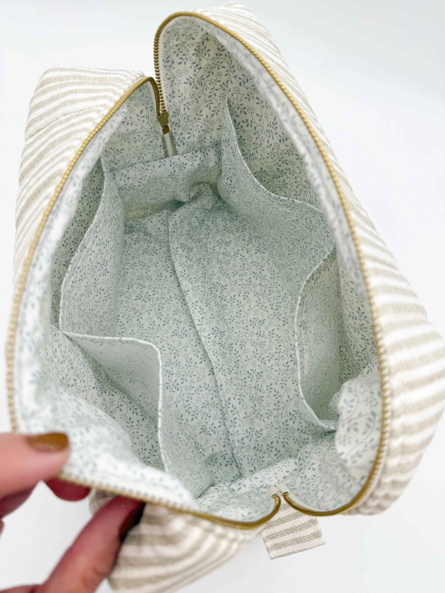 Handmade taupe and cream ticking stripe makeup bag by C2 Creations LLC, with a boxy toiletry and makeup storage design.