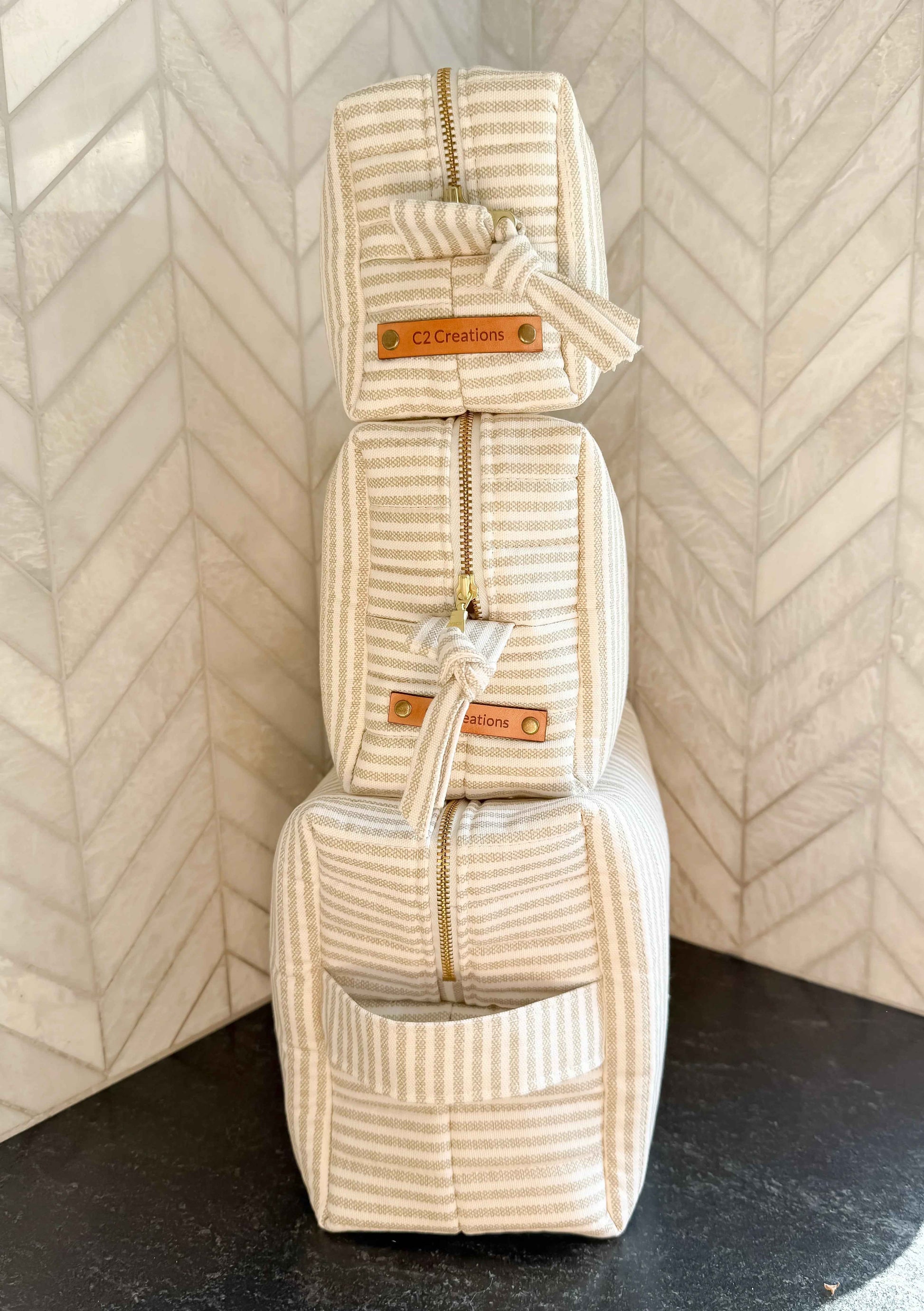 Handmade taupe and cream ticking stripe makeup bag by C2 Creations LLC, boxy toiletry and cosmetics storage with zipper closure.