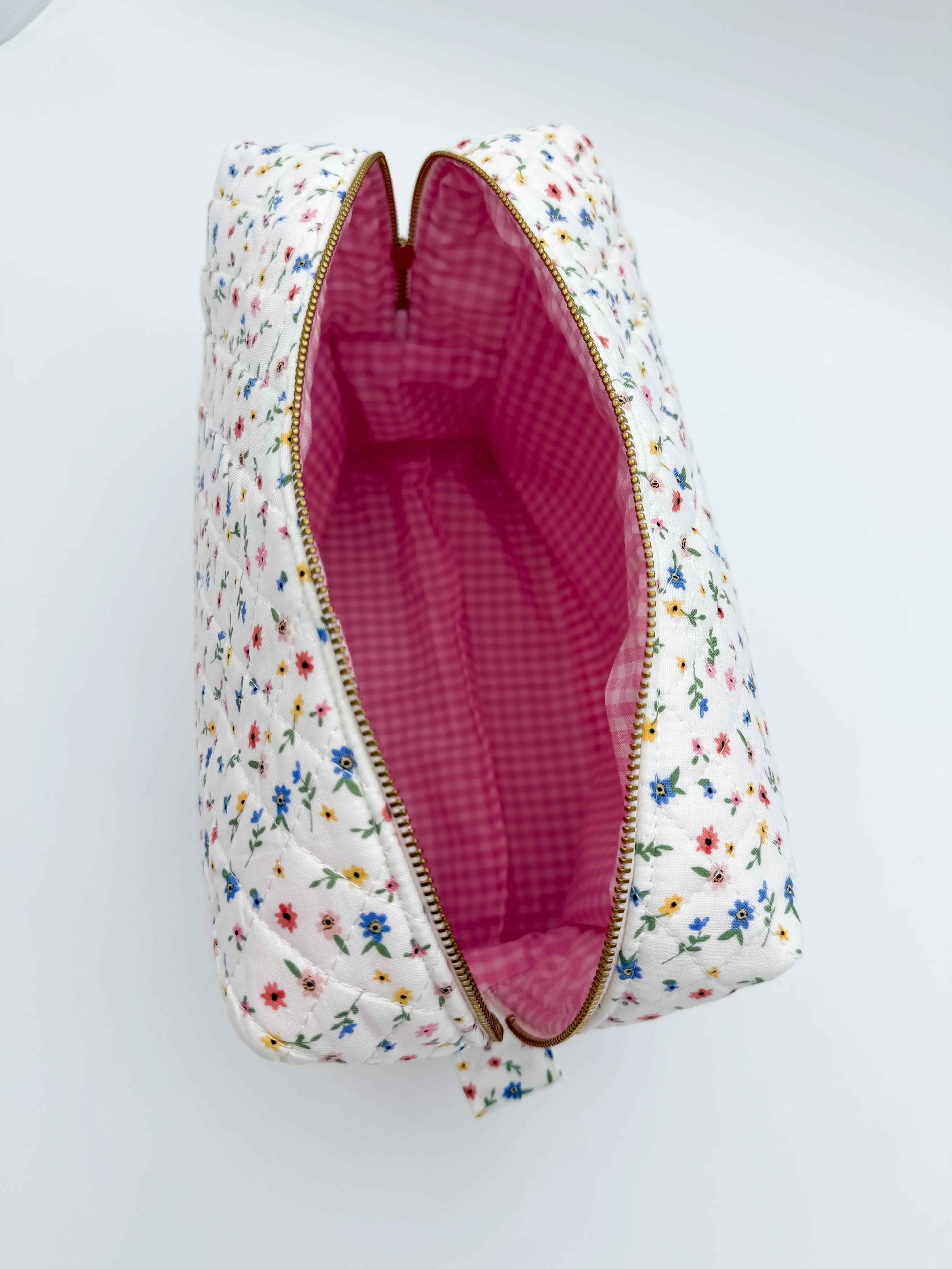 Handmade boxy makeup bag in Wildflower Meadow pattern by C2 Creations LLC, featuring floral design and stylish toiletry storage.