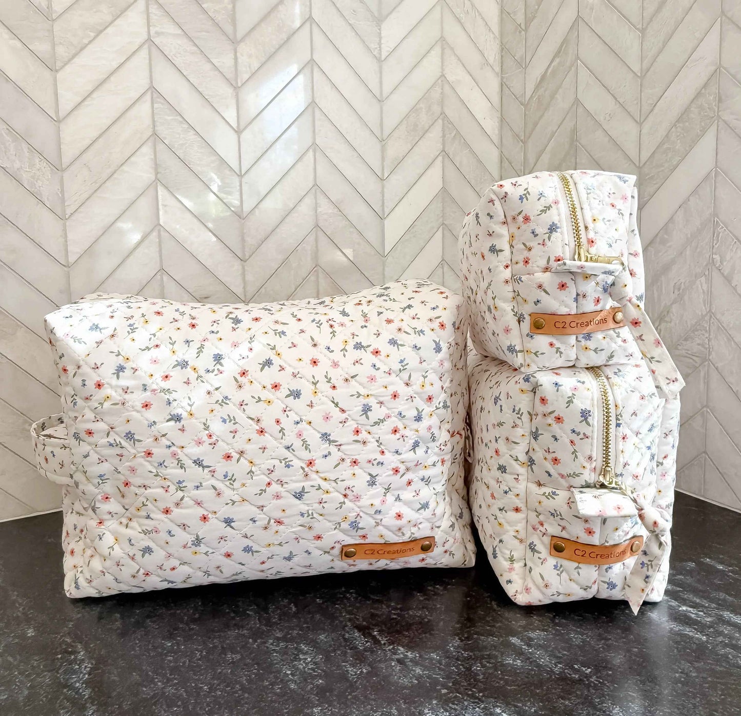 Handmade boxy makeup bag by C2 Creations LLC featuring a wildflower meadow pattern and stylish toiletry storage.
