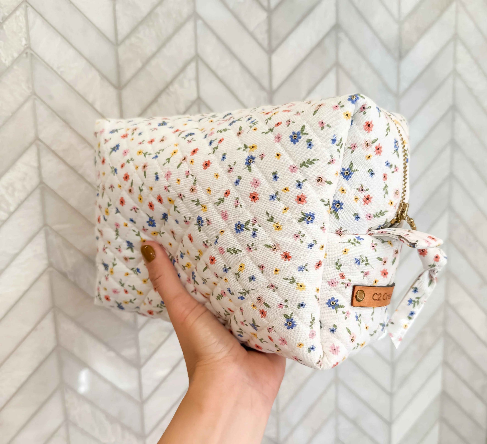 Handmade boxy makeup bag in Wildflower Meadow pattern by C2 Creations LLC, featuring a stylish toiletry bag with floral design.