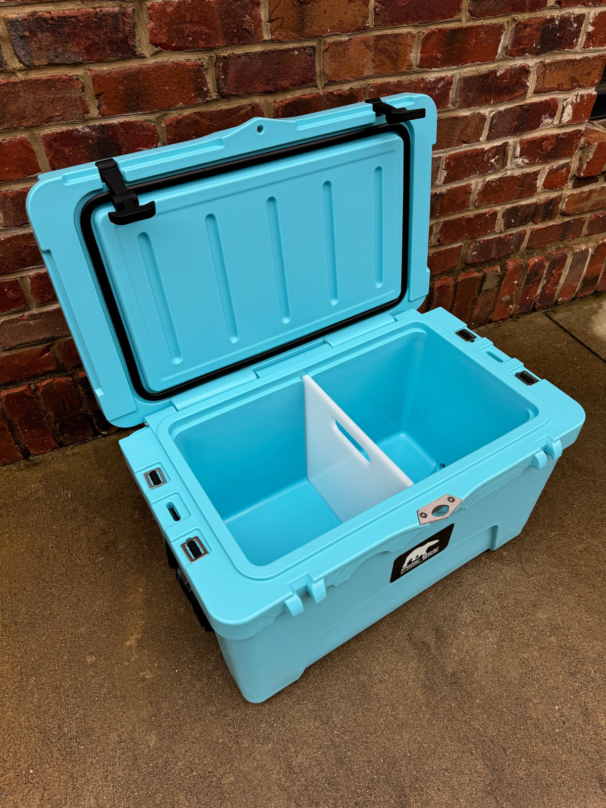 Polar Bear 45 Hard Cooler from Polar Bear Coolers, showing a sturdy white insulated cooler with a secure lid and handles.