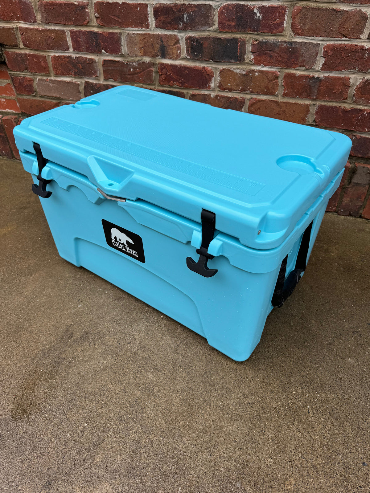 Polar Bear 45 Hard Cooler by Polar Bear Coolers, sturdy white cooler with black handles and lid, suitable for outdoor use.