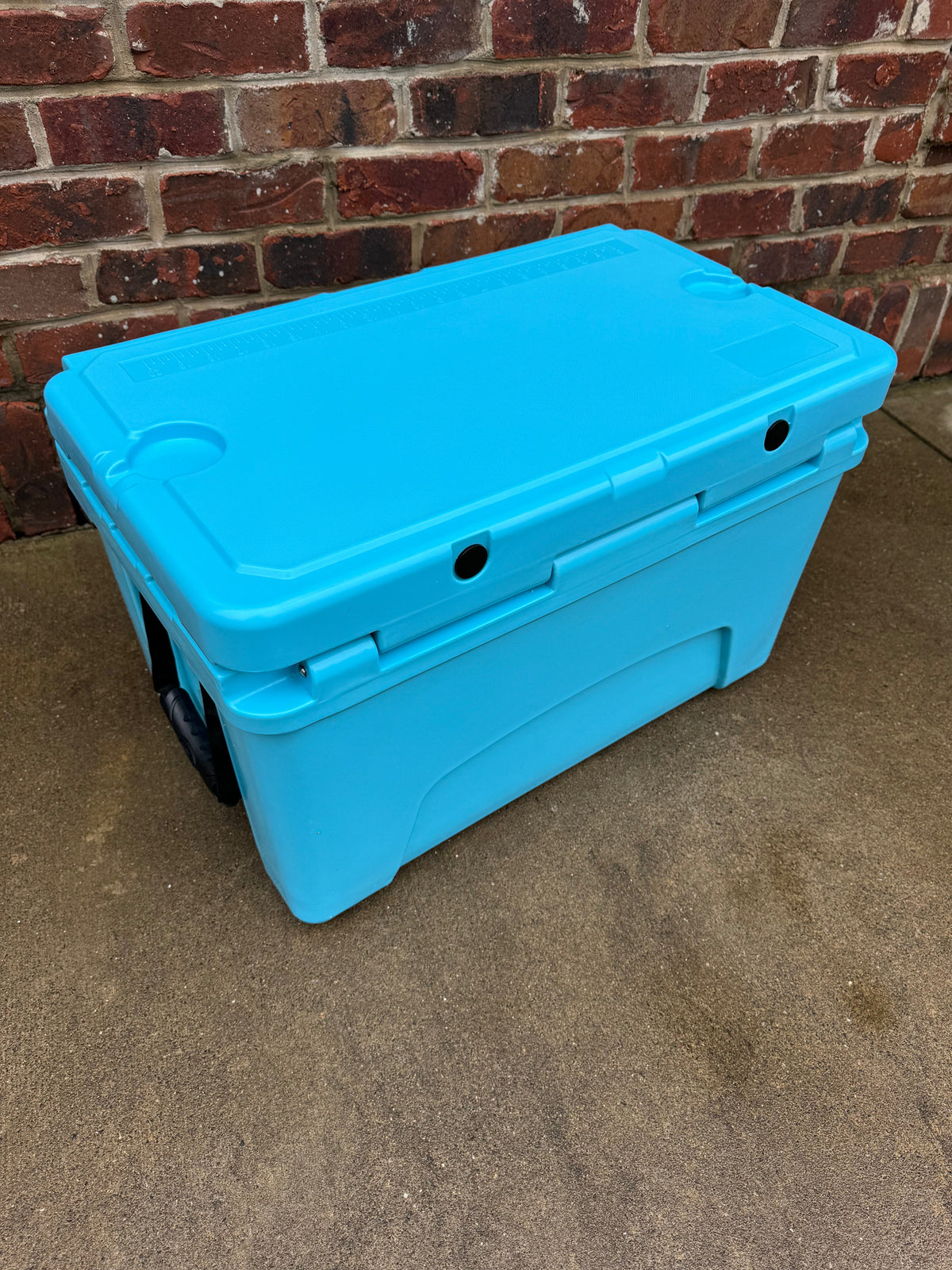 Polar Bear 45 Hard Cooler from Polar Bear Coolers, showing the sturdy white cooler with a black lid and handle.