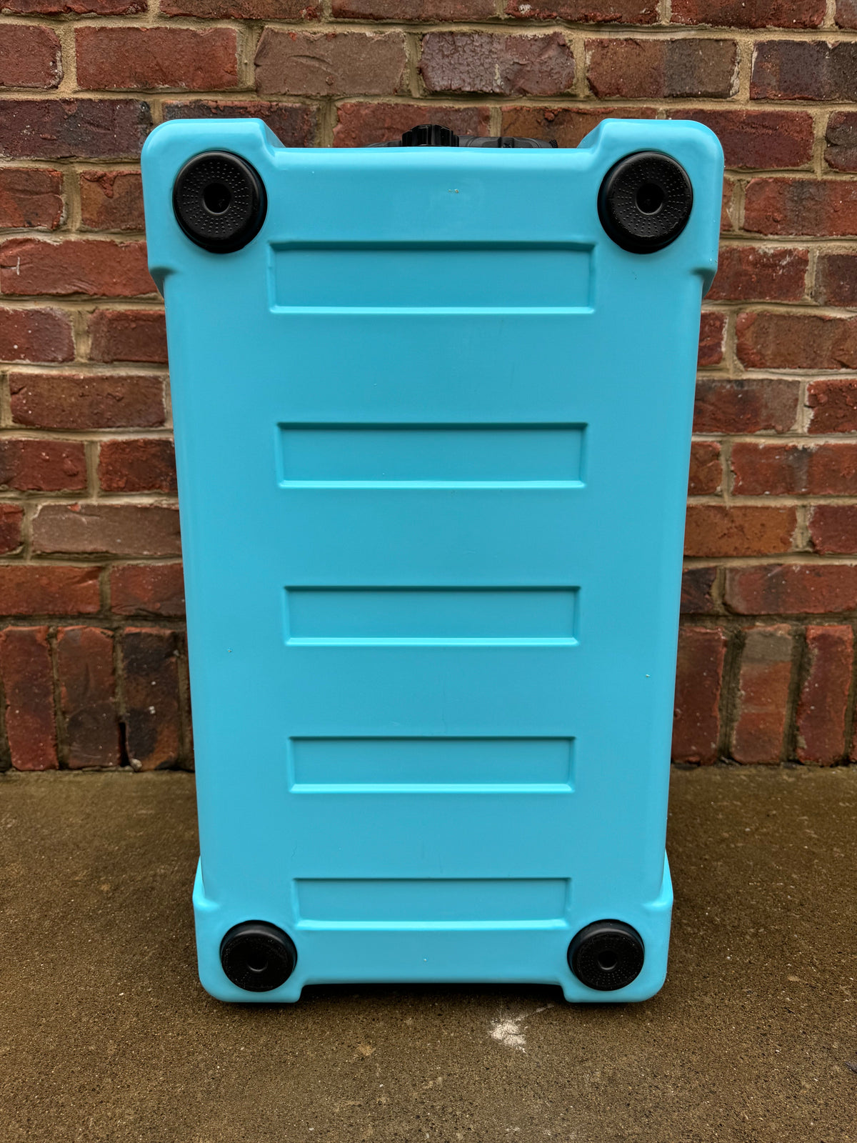 Polar Bear 45 Hard Cooler with rugged exterior and sturdy handle, ideal for keeping food and drinks cold during outdoor activities.