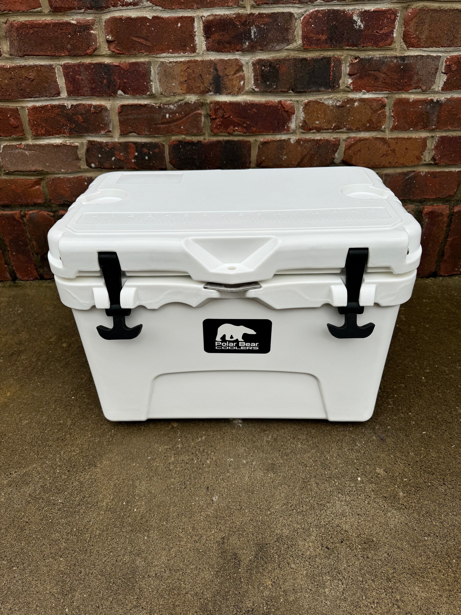 Polar Bear 20 Hard Cooler by Polar Bear Coolers with durable white exterior and sturdy handle for outdoor use.