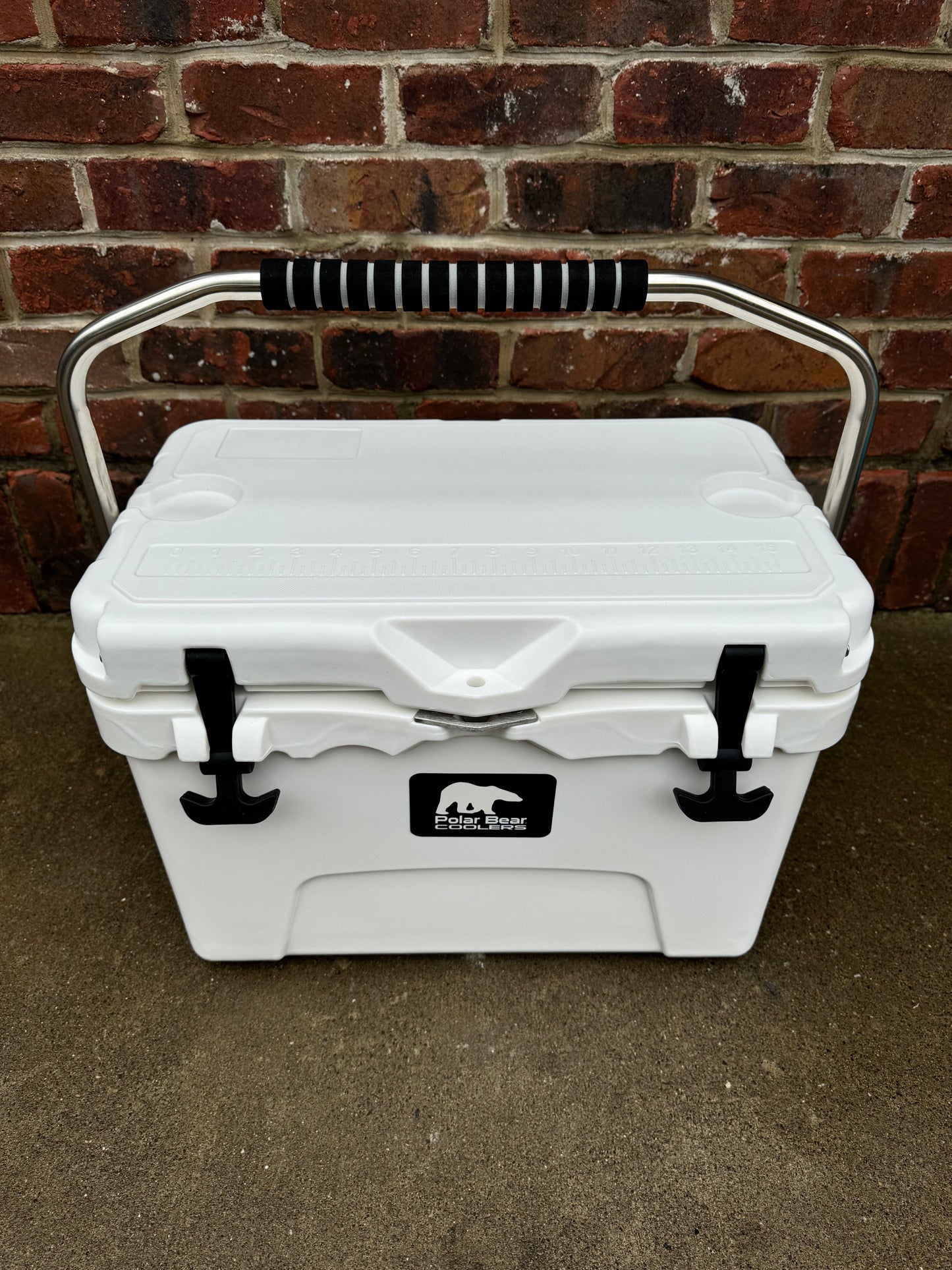Polar Bear 20 Hard Cooler by Polar Bear Coolers, sturdy white cooler with black latches and handle, ideal for outdoor use