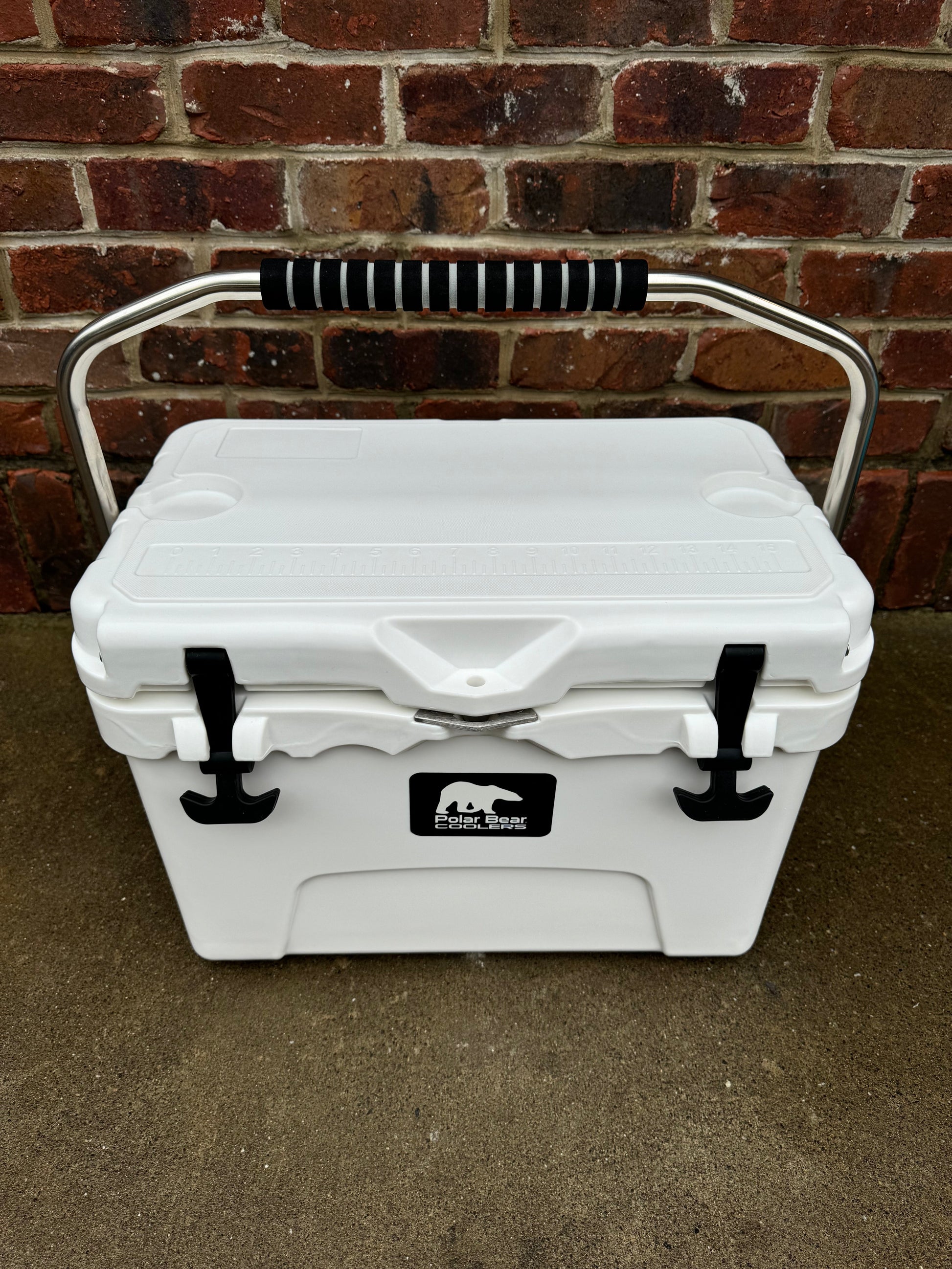 Polar Bear 20 Hard Cooler by Polar Bear Coolers, sturdy white cooler with black latches and handle, ideal for outdoor use