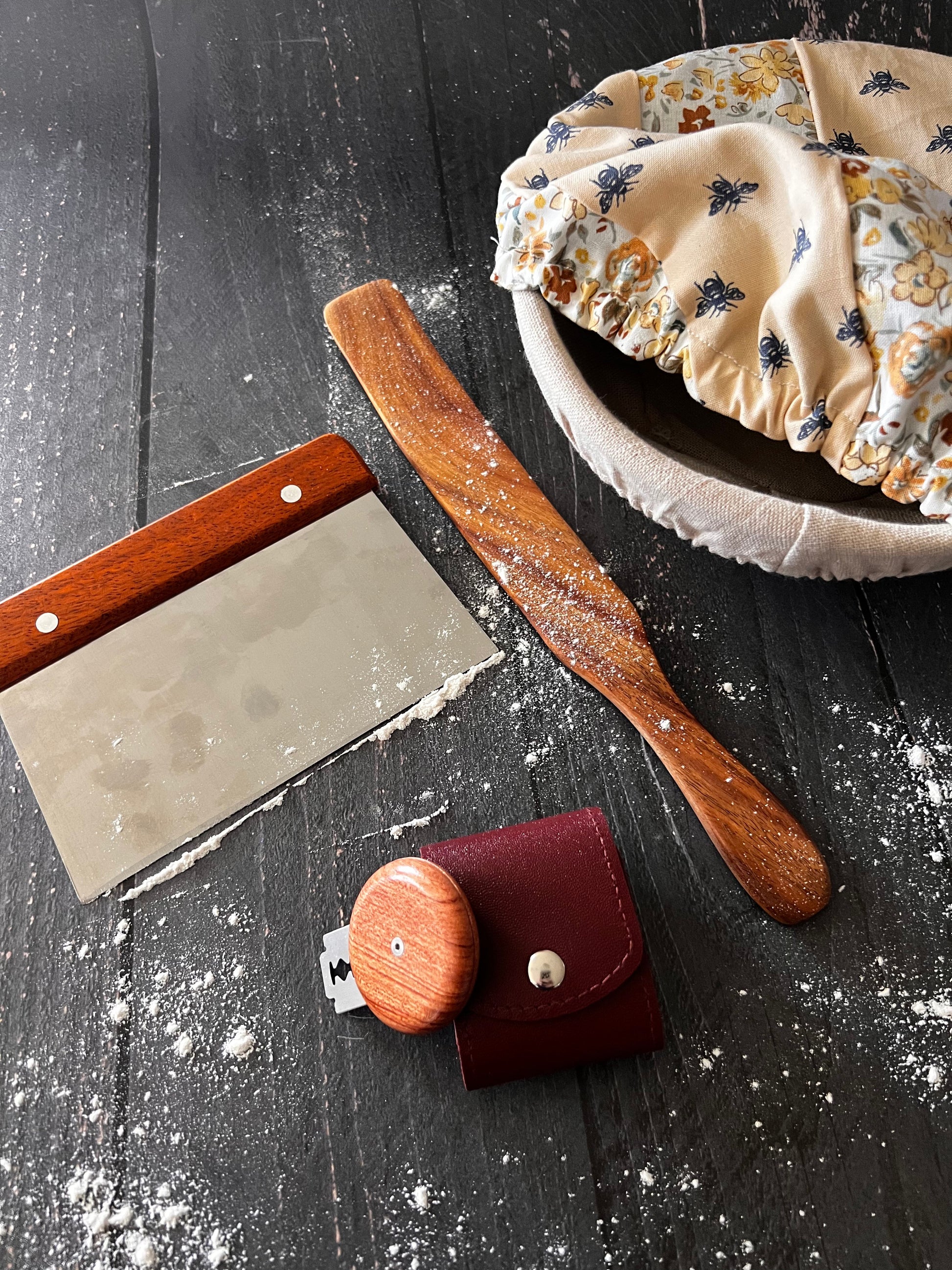 Farmhouse bench scraper from Five Oaks Farm, with wooden handle and stainless steel blade for kitchen baking and dough preparation.